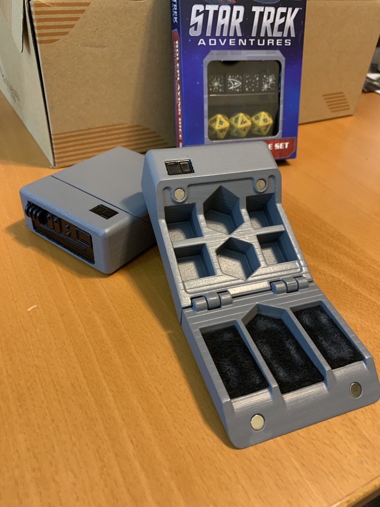 Image of a Star Trek Tricorder prop that is hollowed out inside to use as a dice holder for role playing games