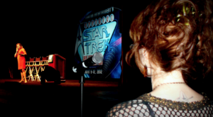 Image of April Eden at STLV in 2012 asking Kate Mulgrew a question
