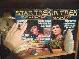 Image of two Star Trek The Magazines, one with Nichelle Nichols on the cover, and the other with Majel Barett on the cover.