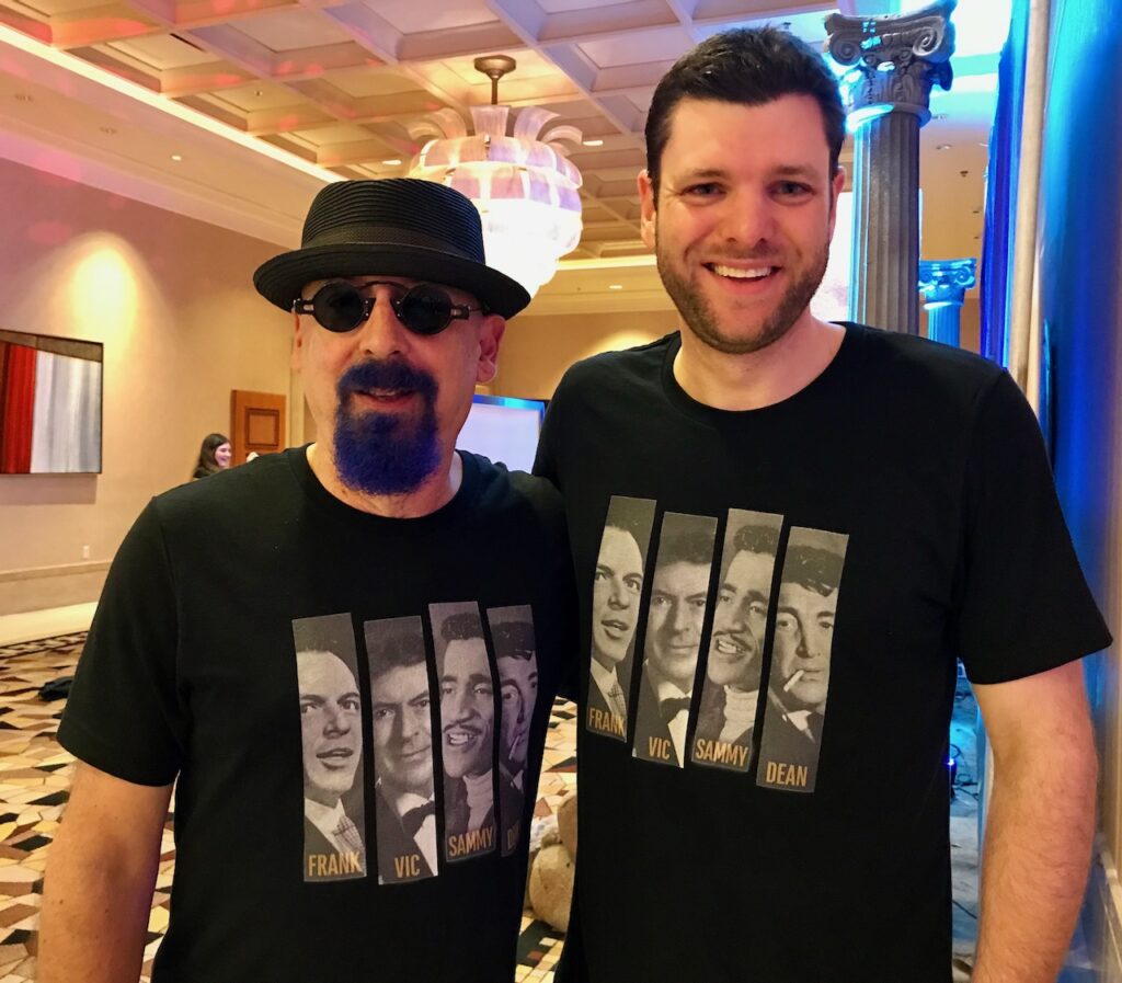 Image of Jamie McGregor with Ira Steven Behr. Both are wearing Jamie's custom Tee shirt with an image of James Darren as a member of the Rat Pack.