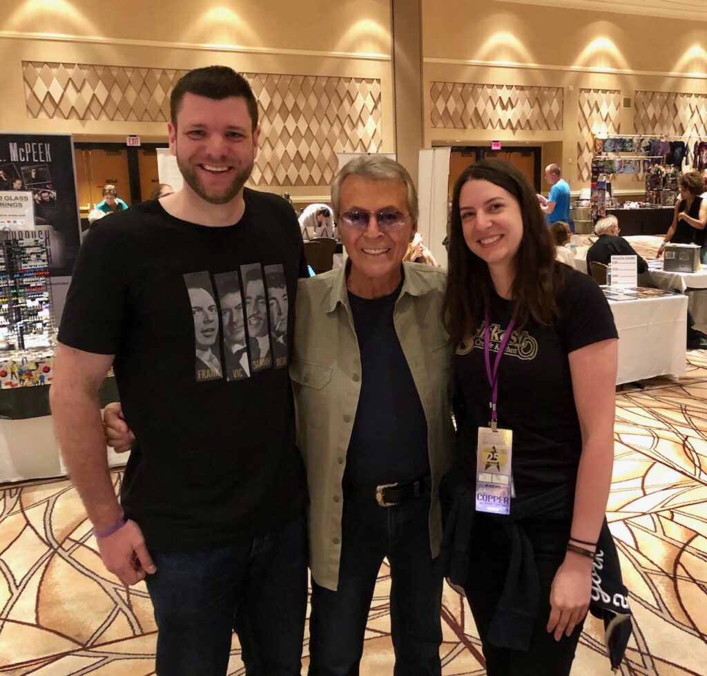 Image of Jamie McGregor, his sister Lyrian McGregor, and James Darren in the vendor's room at the STLV convention.